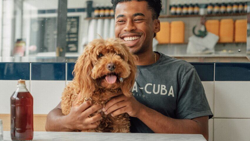 Man with dog on lap